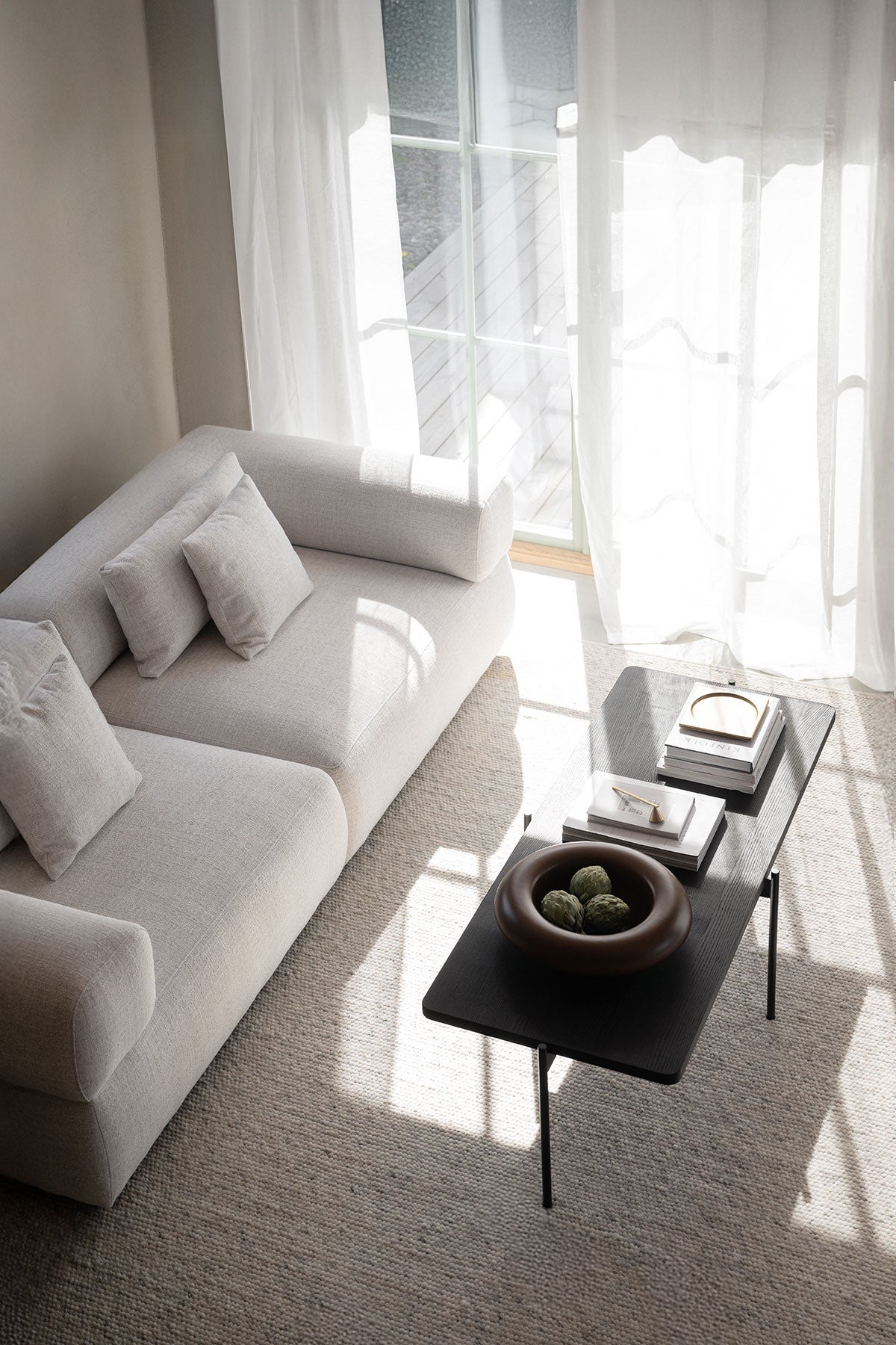 Rowico-Shelton-Coffee-Table-Black-Ash-145x60-Lifestyle-1